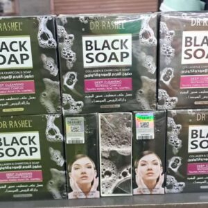 "Dr. Rashel black soap bar displayed on a white surface."