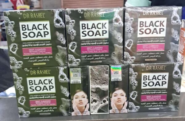 "Dr. Rashel black soap bar displayed on a white surface."