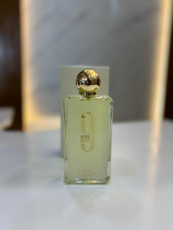 "Image of 9 AM Afnan Perfume: A sleek bottle of fragrance with a vibrant, invigorating scent perfect for the morning."